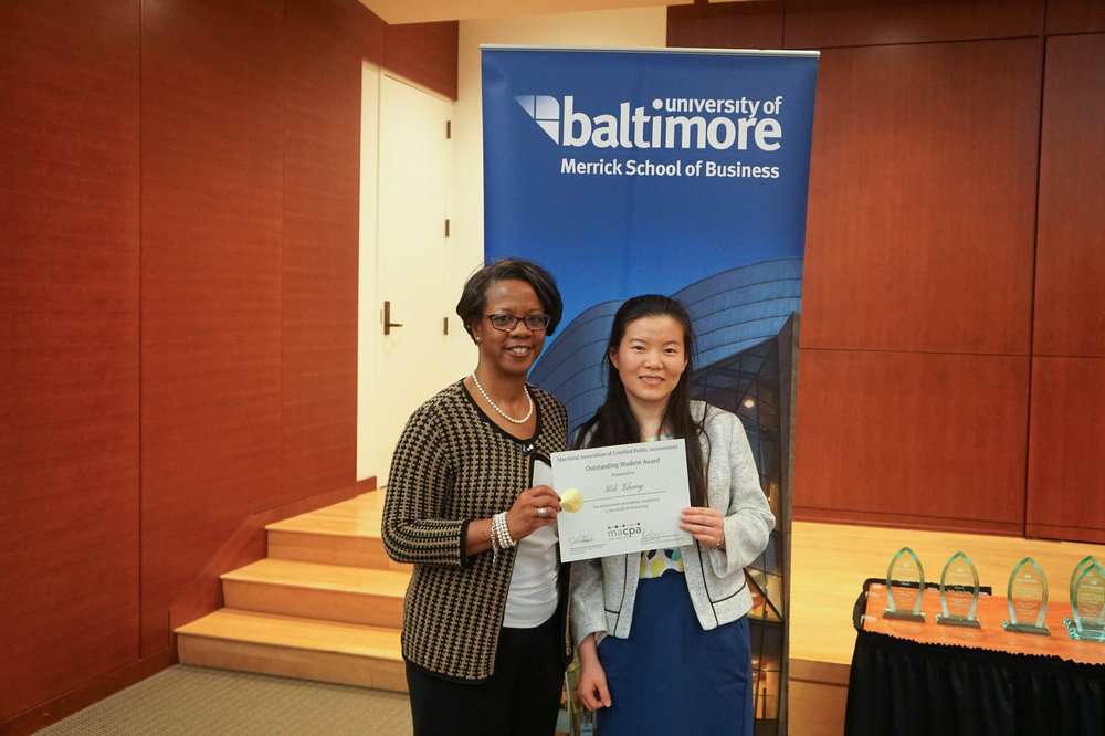 Associate Professor of Accounting Jan Williams and Keli Zhang, M.S. '17, pose after Keli won the MACPA Outstanding Student Award