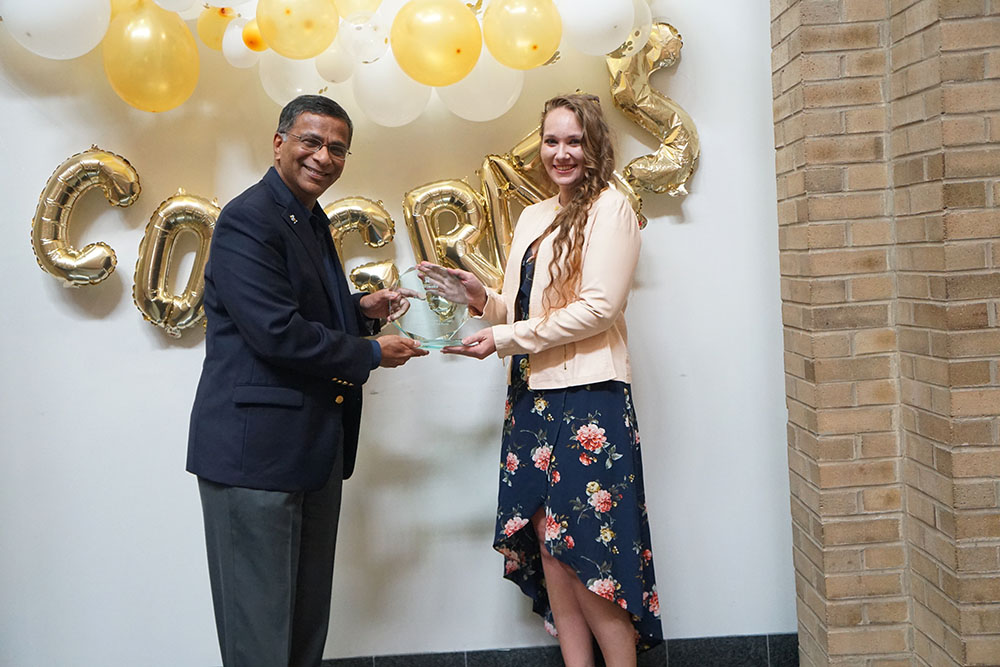 Dean Balakrishnan poses with the 2024 Dean's Award recipient, Nicolina Messercola